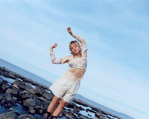 Songwriter Pem in front of blue sky