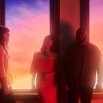 Khruangbin on orange background