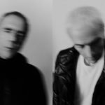 promotional shot of electronic duo Underworld