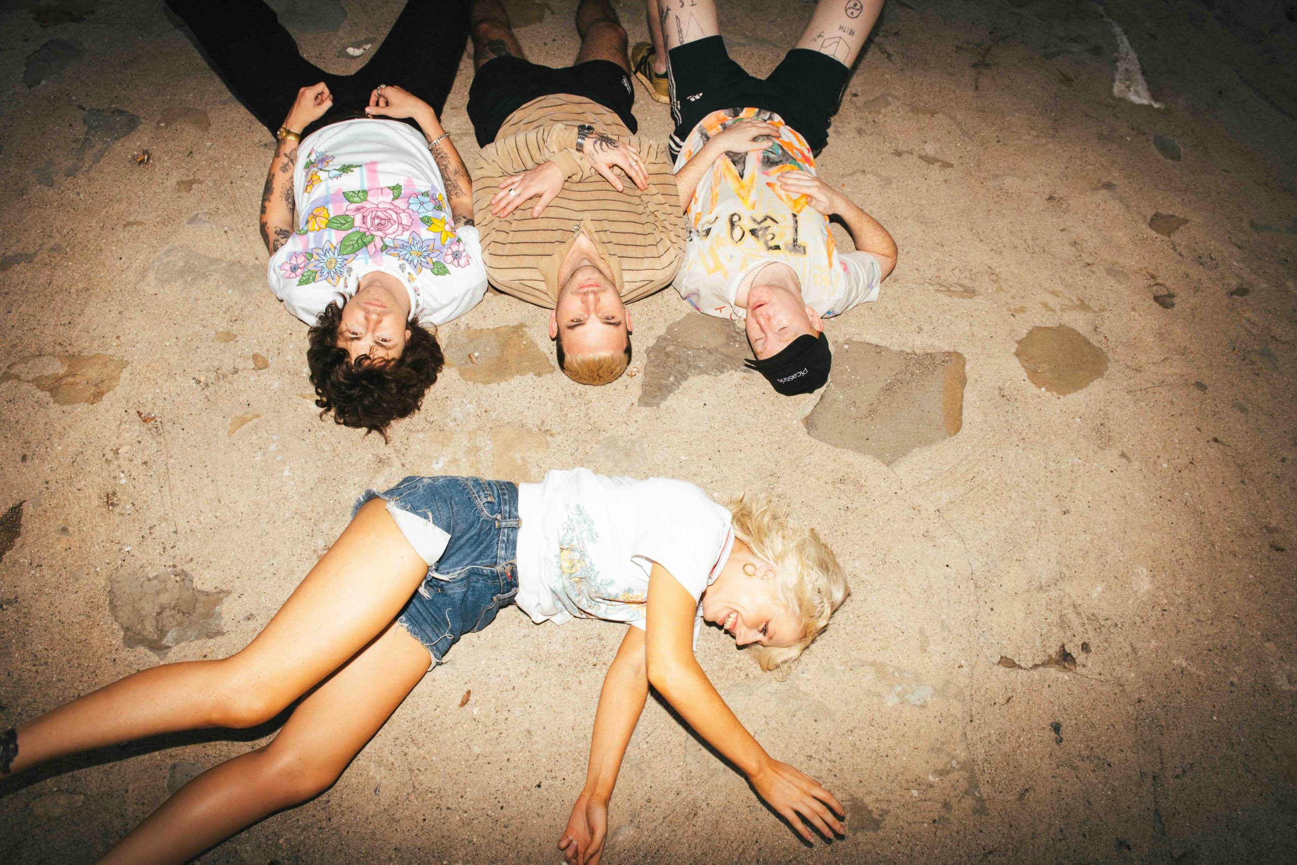 Amyl and The Sniffers promotional photo on a beach